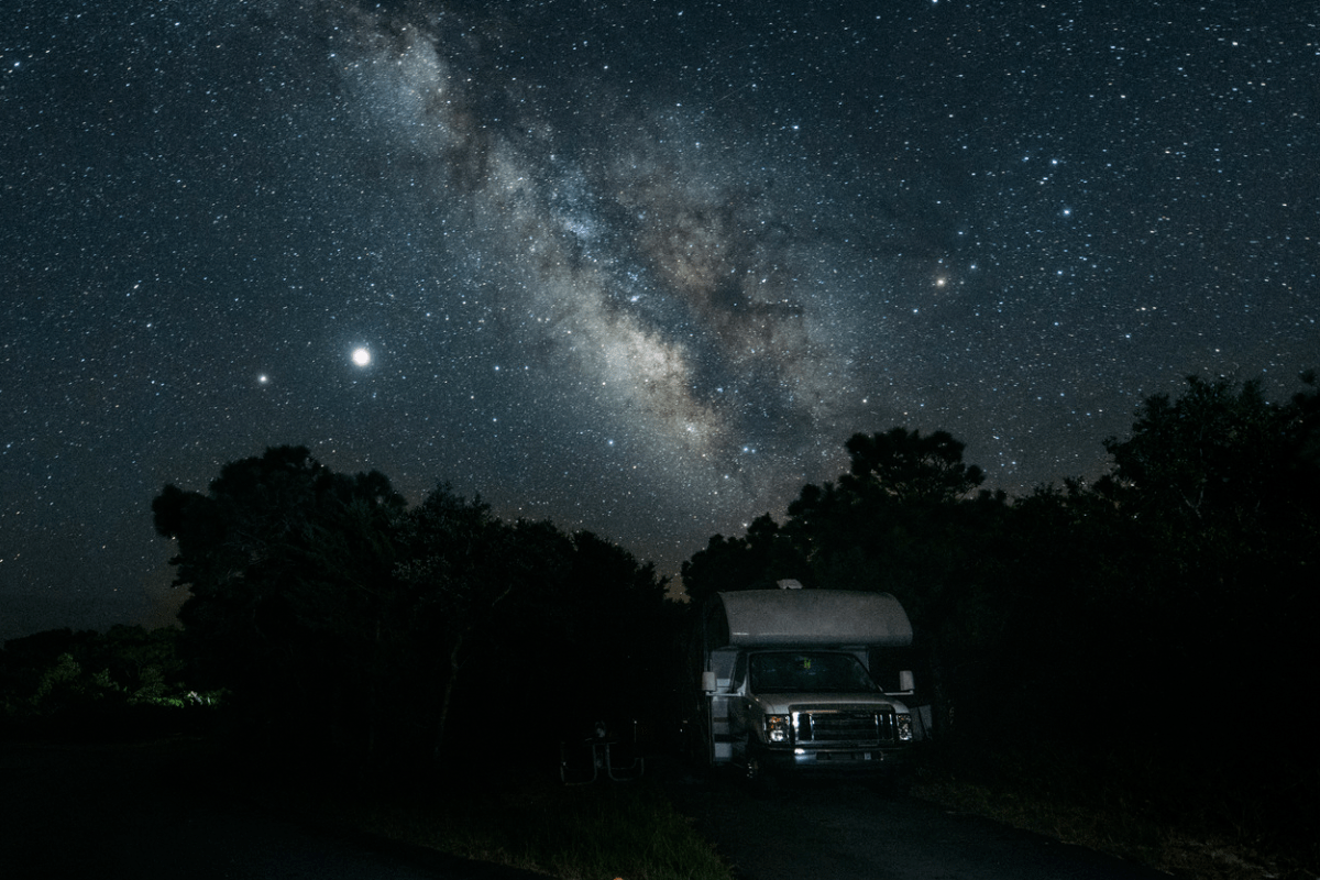 RV and the night sky with a lot of stars